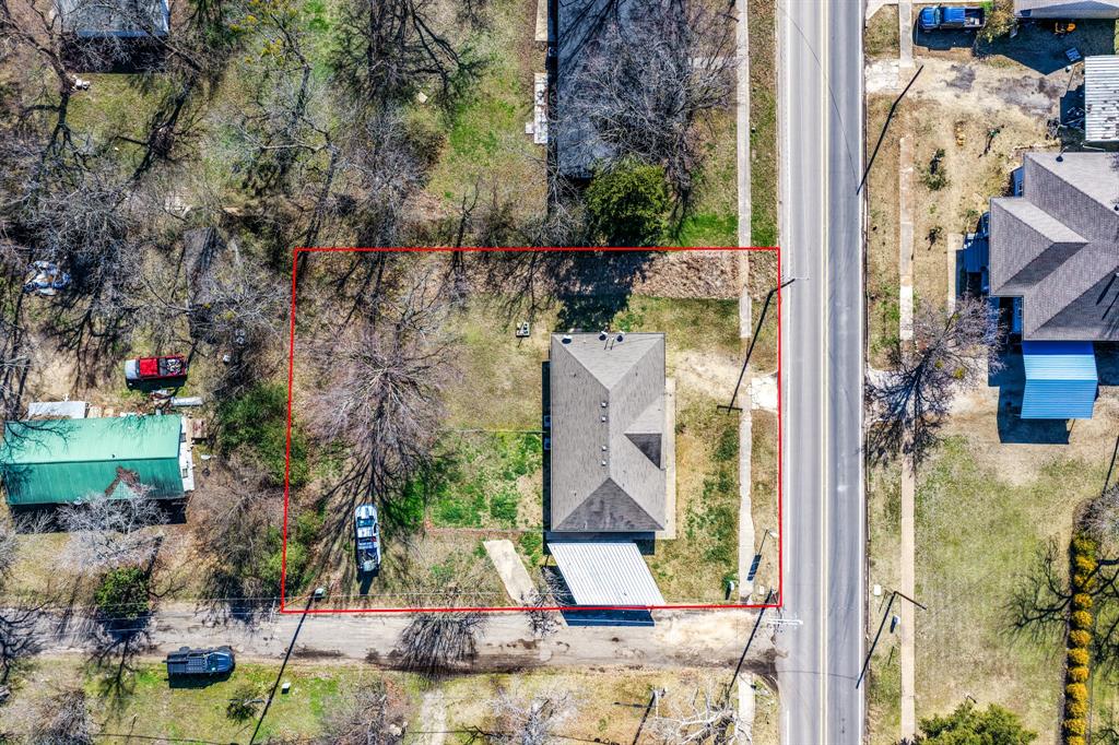 701 Southwest 1st Street Cooper, TX 75432 - Photo 3 of 22 a bird view of a house with a yard
