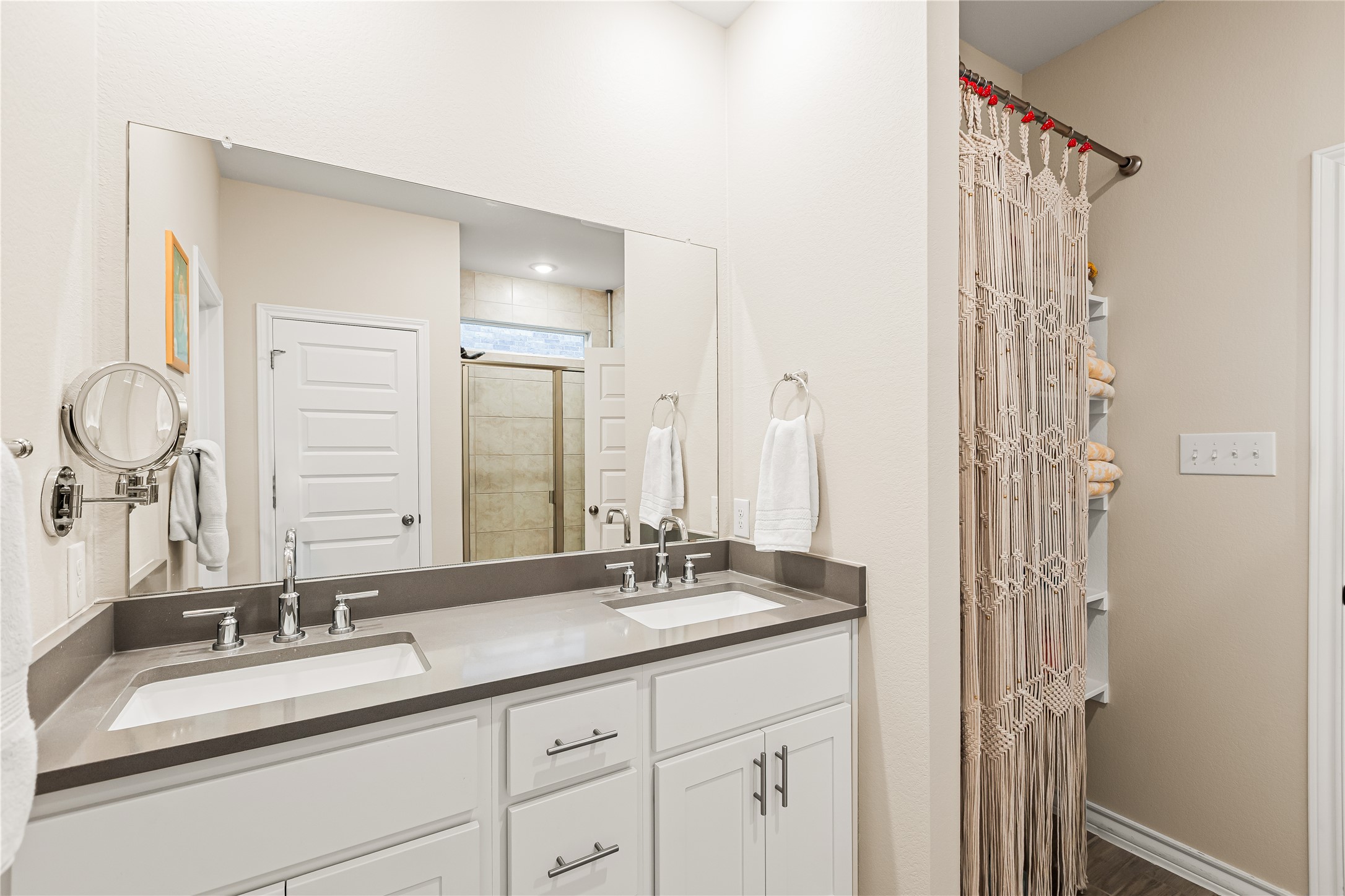 862 Pepperbark Loop Buda, TX 78610 - Photo 21 of 40 a bathroom with a double vanity sink and a mirror