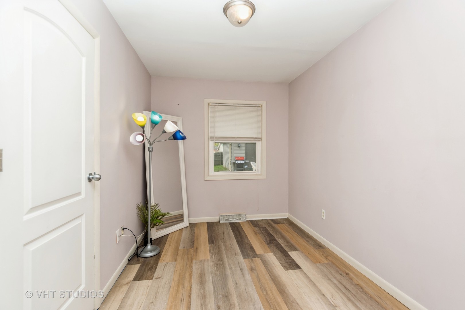 317 Stuart Road Lockport, IL 60441 - Photo 12 of 16 a view of empty room with wooden floor and fan