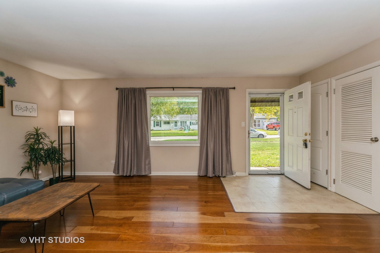 317 Stuart Road Lockport, IL 60441 - Photo 2 of 16 a view of a livingroom with wooden floor and a window