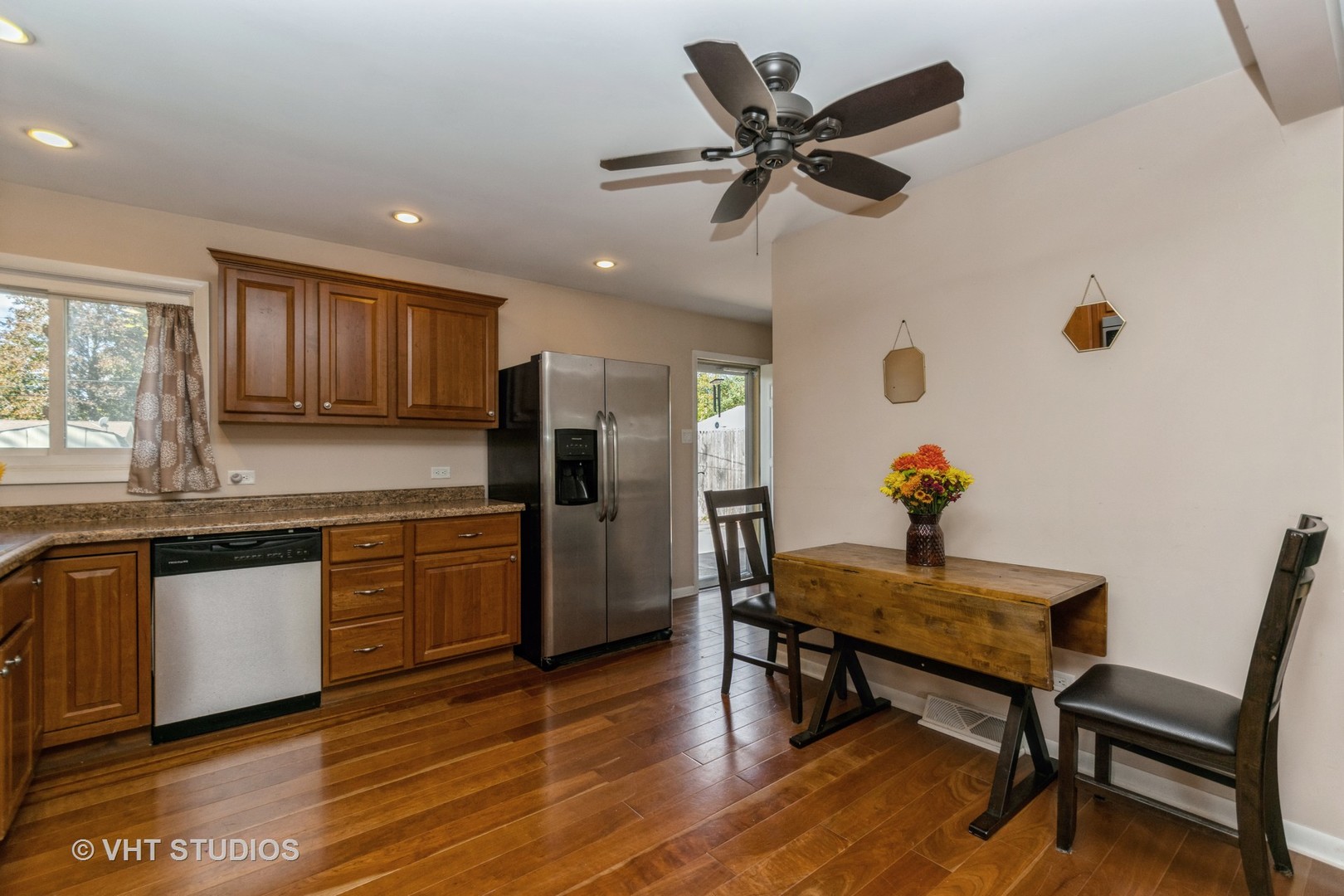 317 Stuart Road Lockport, IL 60441 - Photo 5 of 16 a kitchen with granite countertop white cabinets and stainless steel appliances