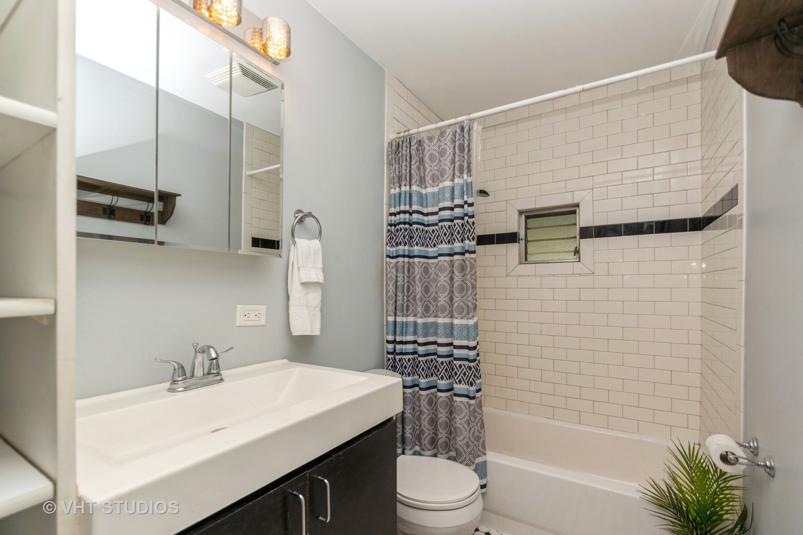 317 Stuart Road Lockport, IL 60441 - Photo 9 of 16 a bathroom with a sink a toilet and shower