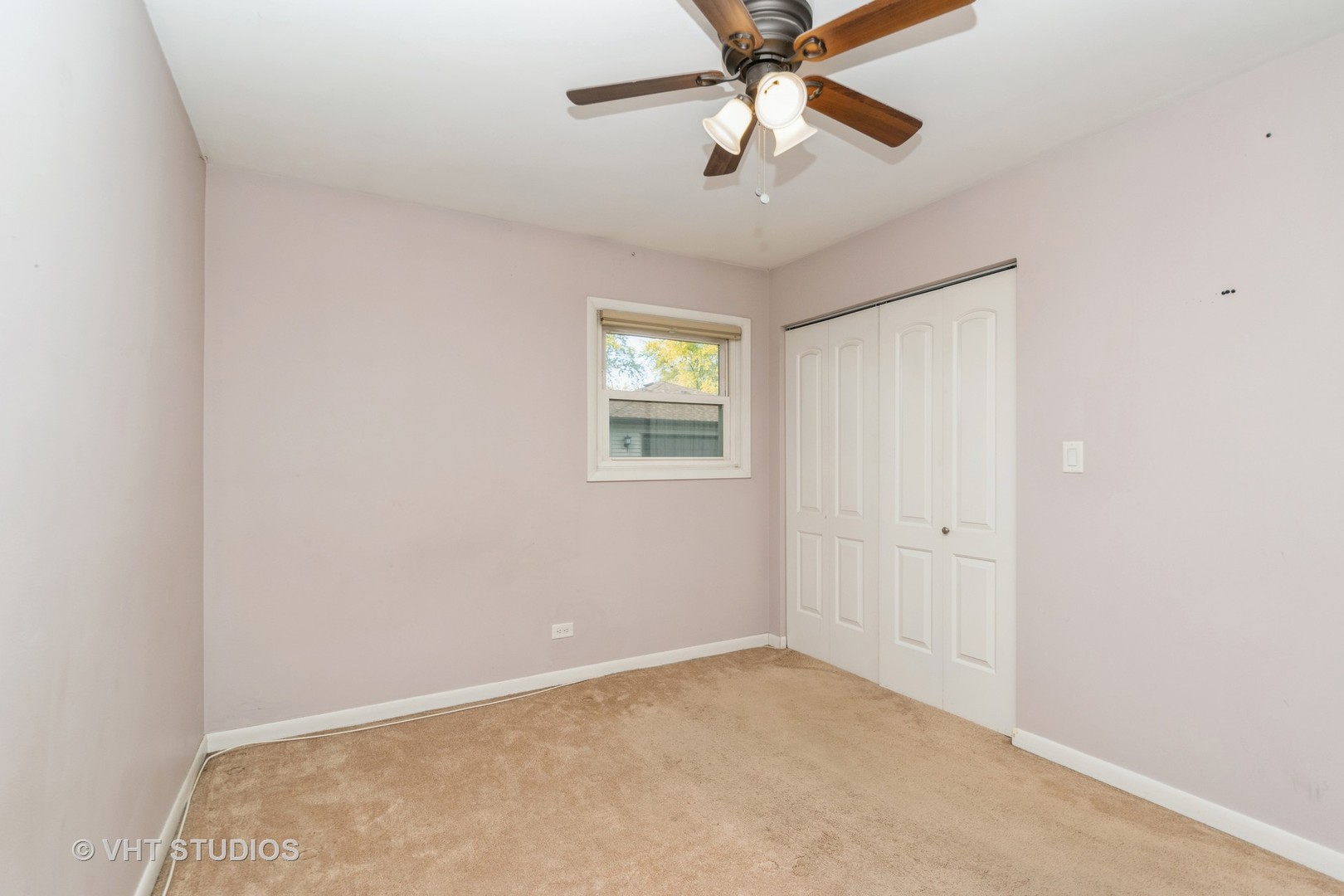 317 Stuart Road Lockport, IL 60441 - Photo 10 of 16 an empty room with windows and fan