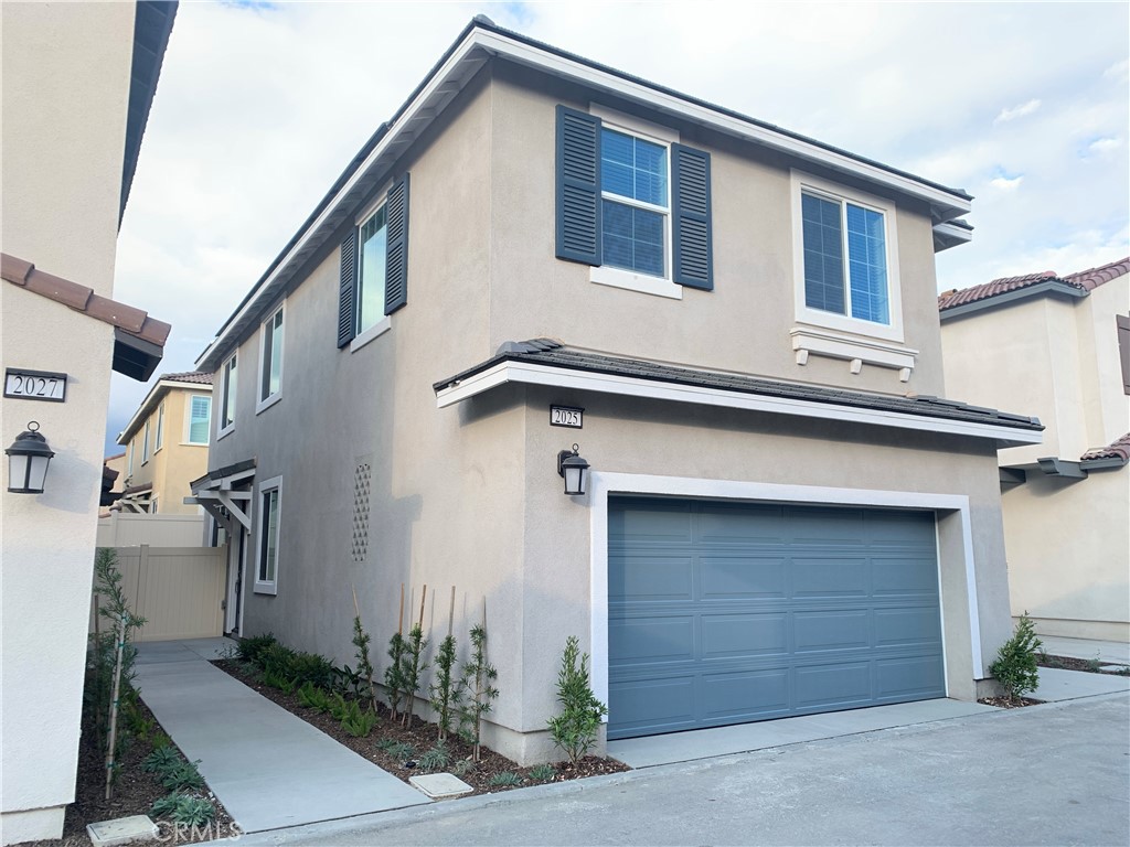 a front view of a house with garage