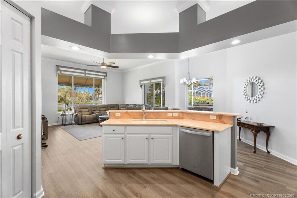 758 Southwest Blue Stem Way Stuart, FL 34997 - Photo 14 of 49 a large white kitchen with a large window