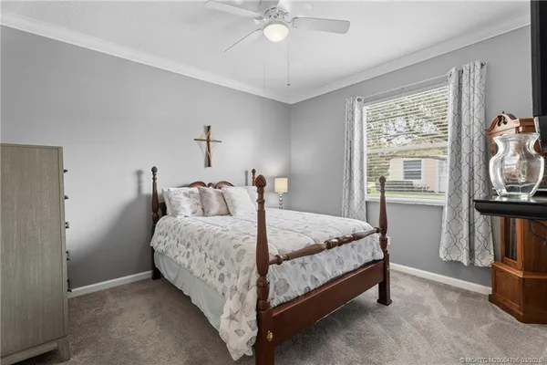 a bed room with a bed and a tv