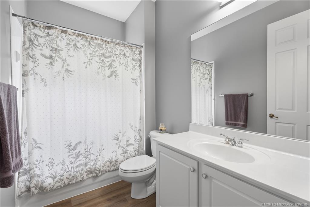 758 Southwest Blue Stem Way Stuart, FL 34997 - Photo 29 of 49 a bathroom with a toilet sink and shower