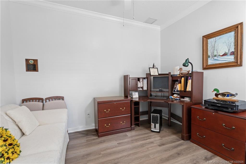 758 Southwest Blue Stem Way Stuart, FL 34997 - Photo 35 of 49 a view of a workspace with furniture and wooden floor