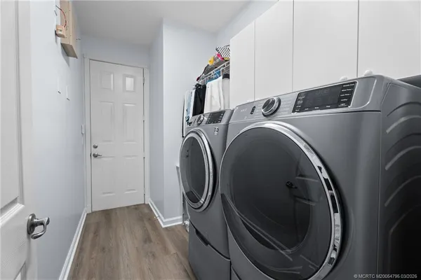 a utility room with dryer and washer