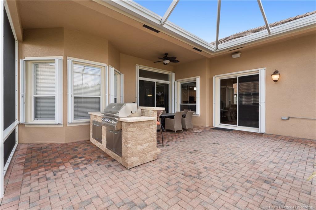 758 Southwest Blue Stem Way Stuart, FL 34997 - Photo 37 of 49 a view of a white house with wooden floor and furniture