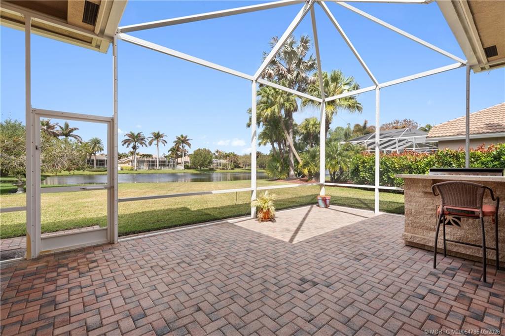 758 Southwest Blue Stem Way Stuart, FL 34997 - Photo 40 of 49 a view of a park with lounge chairs