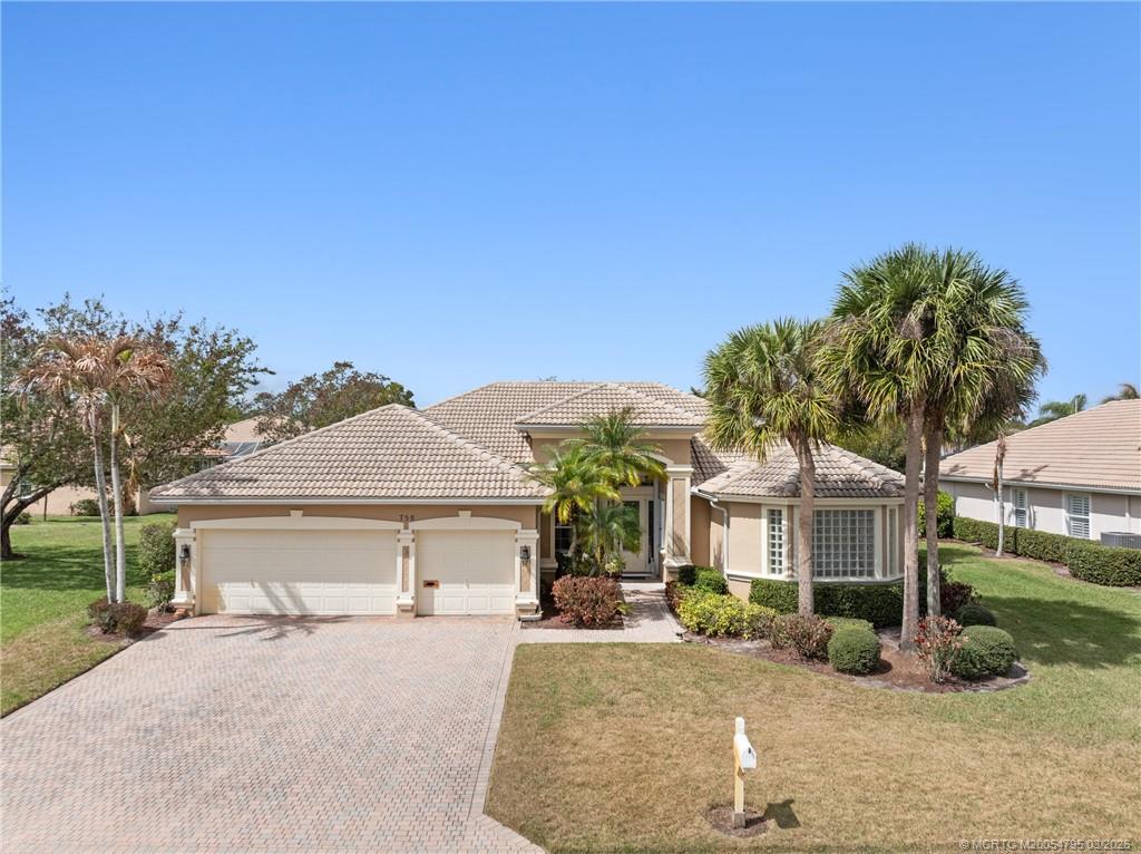 758 Southwest Blue Stem Way Stuart, FL 34997 - Photo 45 of 49 front view of a house with a yard