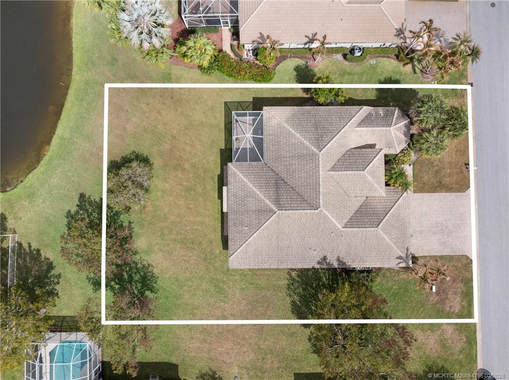 758 Southwest Blue Stem Way Stuart, FL 34997 - Photo 46 of 49 an aerial view of a house with a yard
