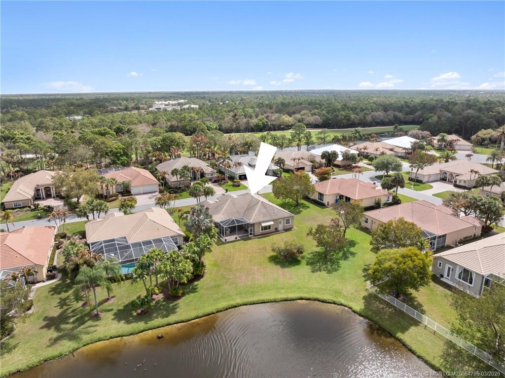758 Southwest Blue Stem Way Stuart, FL 34997 - Photo 48 of 49 an aerial view of residential houses with outdoor space