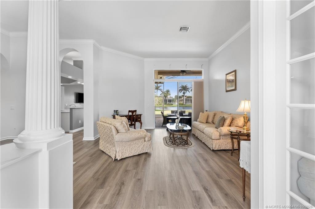 758 Southwest Blue Stem Way Stuart, FL 34997 - Photo 5 of 49 a living room with furniture and a couch