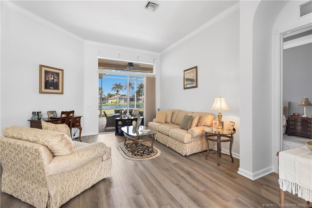 758 Southwest Blue Stem Way Stuart, FL 34997 - Photo 6 of 49 a living room with furniture and a wooden floor