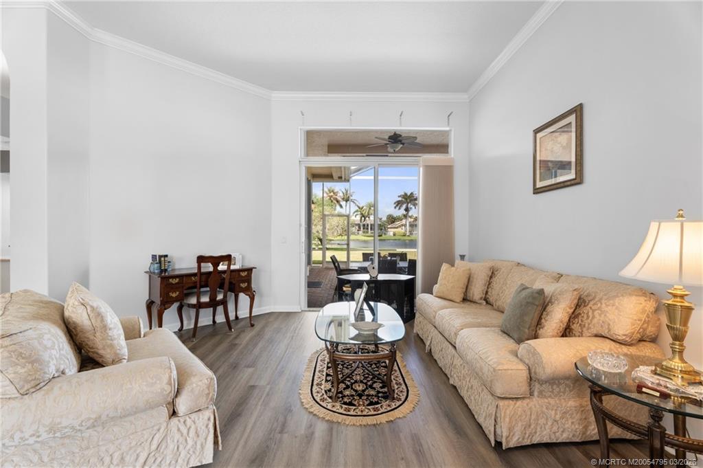758 Southwest Blue Stem Way Stuart, FL 34997 - Photo 7 of 49 a living room with furniture and a large window