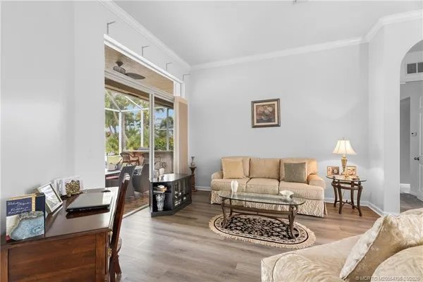 a living room with furniture and a window