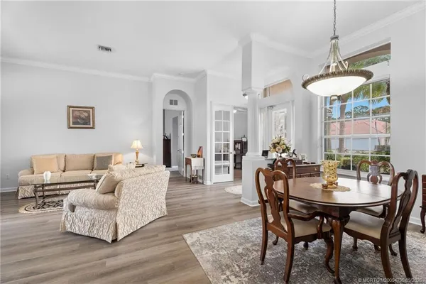a living room with furniture and a table