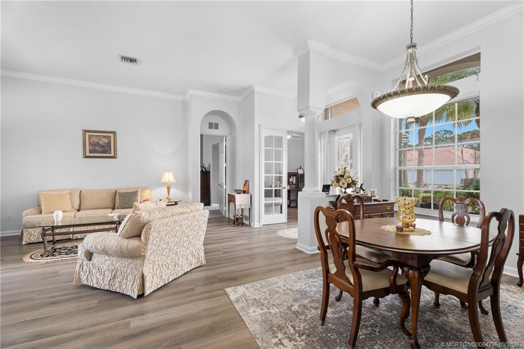 758 Southwest Blue Stem Way Stuart, FL 34997 - Photo 9 of 49 a living room with furniture and a table