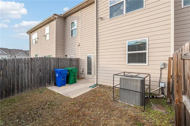 a backyard of a house with barbeque oven