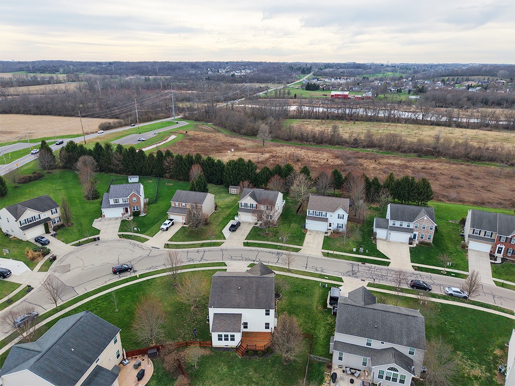 1978 Spring Ridge Drive Xenia, OH 45385 - Photo 44 of 44 This aerial view showcases a residential neighborhood nestled beside open fields.