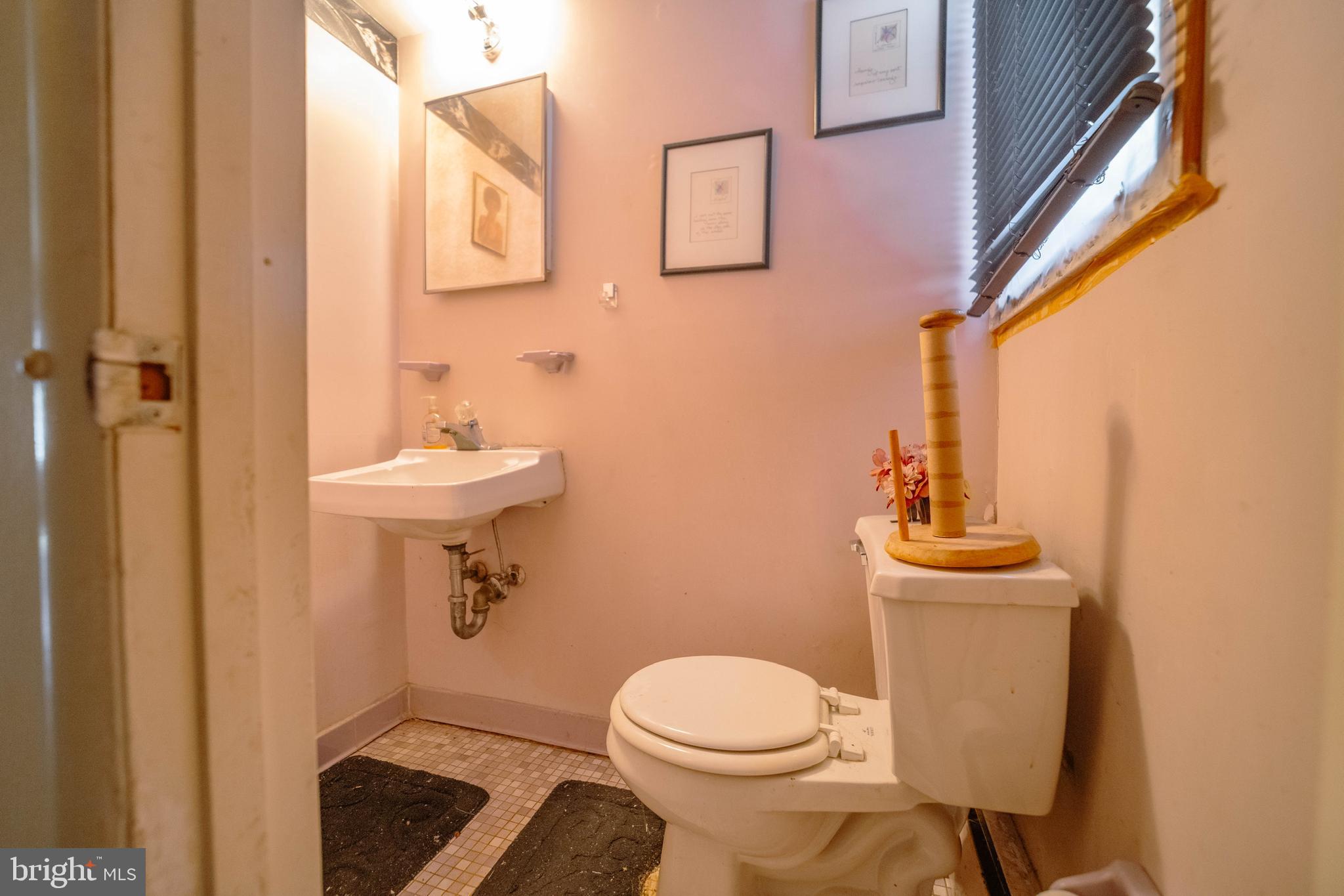 6900 Temple Hill Road Temple Hills, MD 20748 - Photo 8 of 43 a bathroom with a toilet sink and mirror
