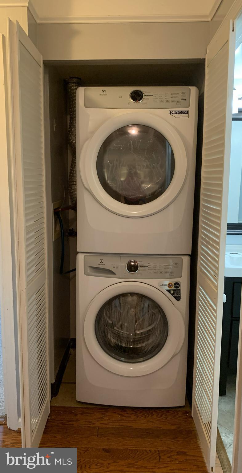 5800 Cove Landing Road, Unit 303 Burke, VA 22015 - Photo 32 of 84 a utility room with dryer and washer