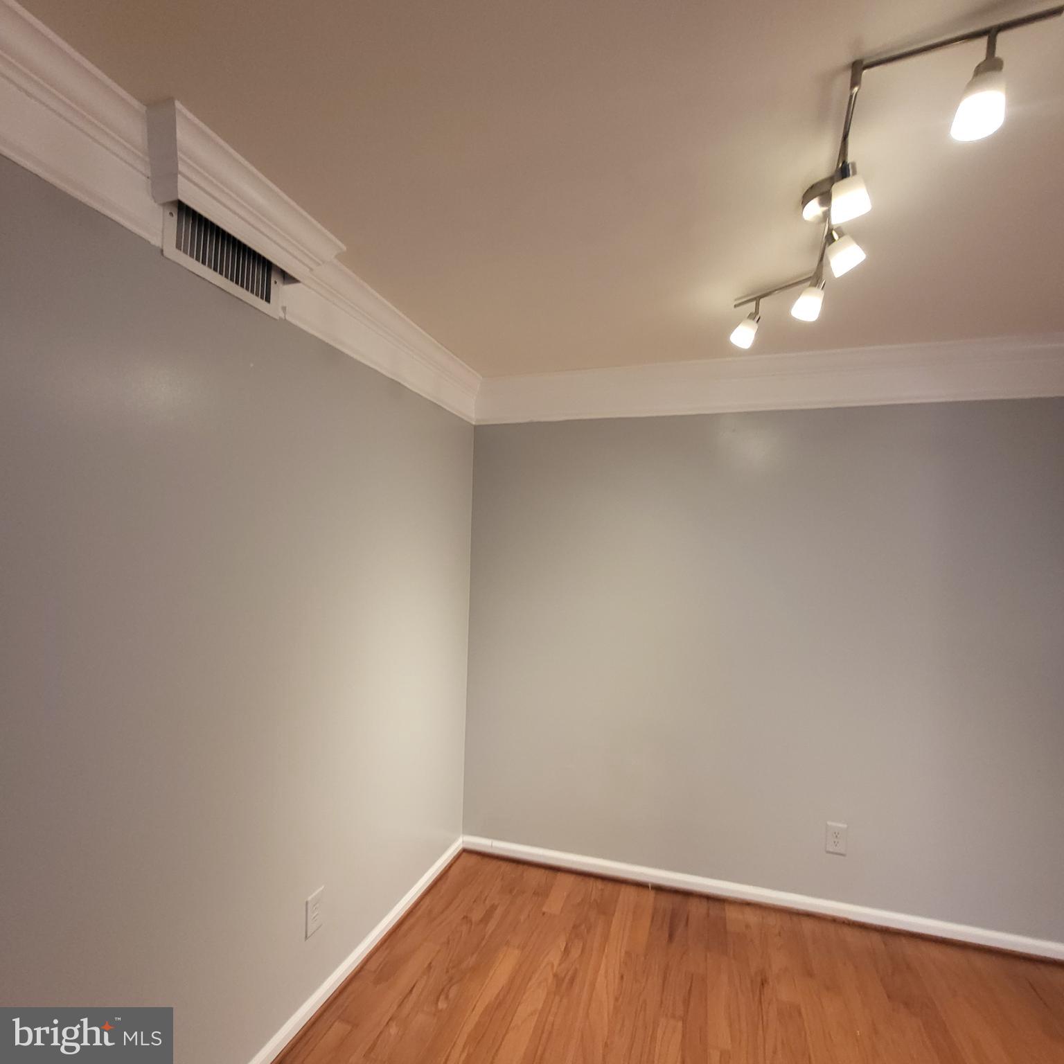 5800 Cove Landing Road, Unit 303 Burke, VA 22015 - Photo 33 of 84 Crown molding and new light fixtures in dining are