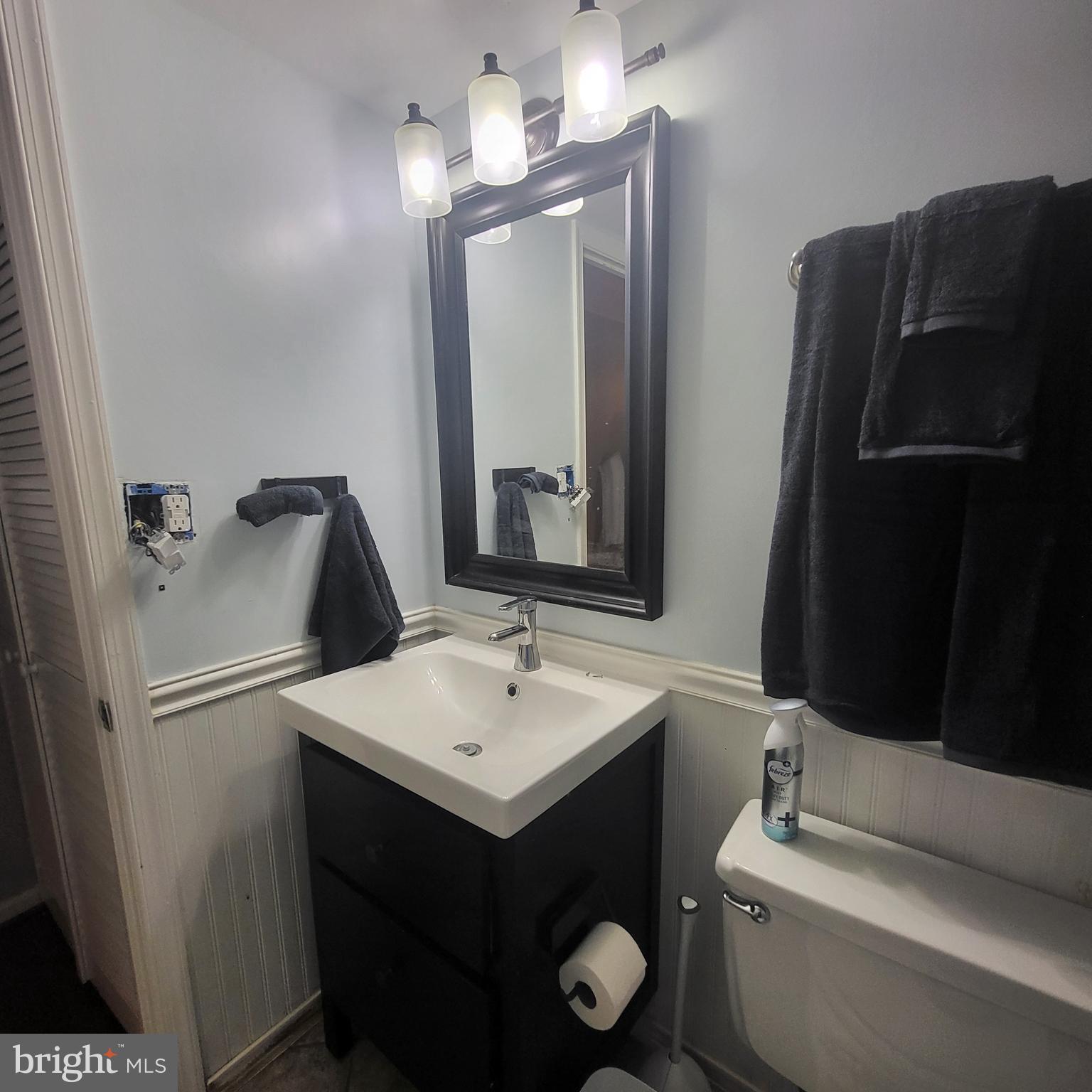 5800 Cove Landing Road, Unit 303 Burke, VA 22015 - Photo 62 of 84 a bathroom with a sink and a mirror