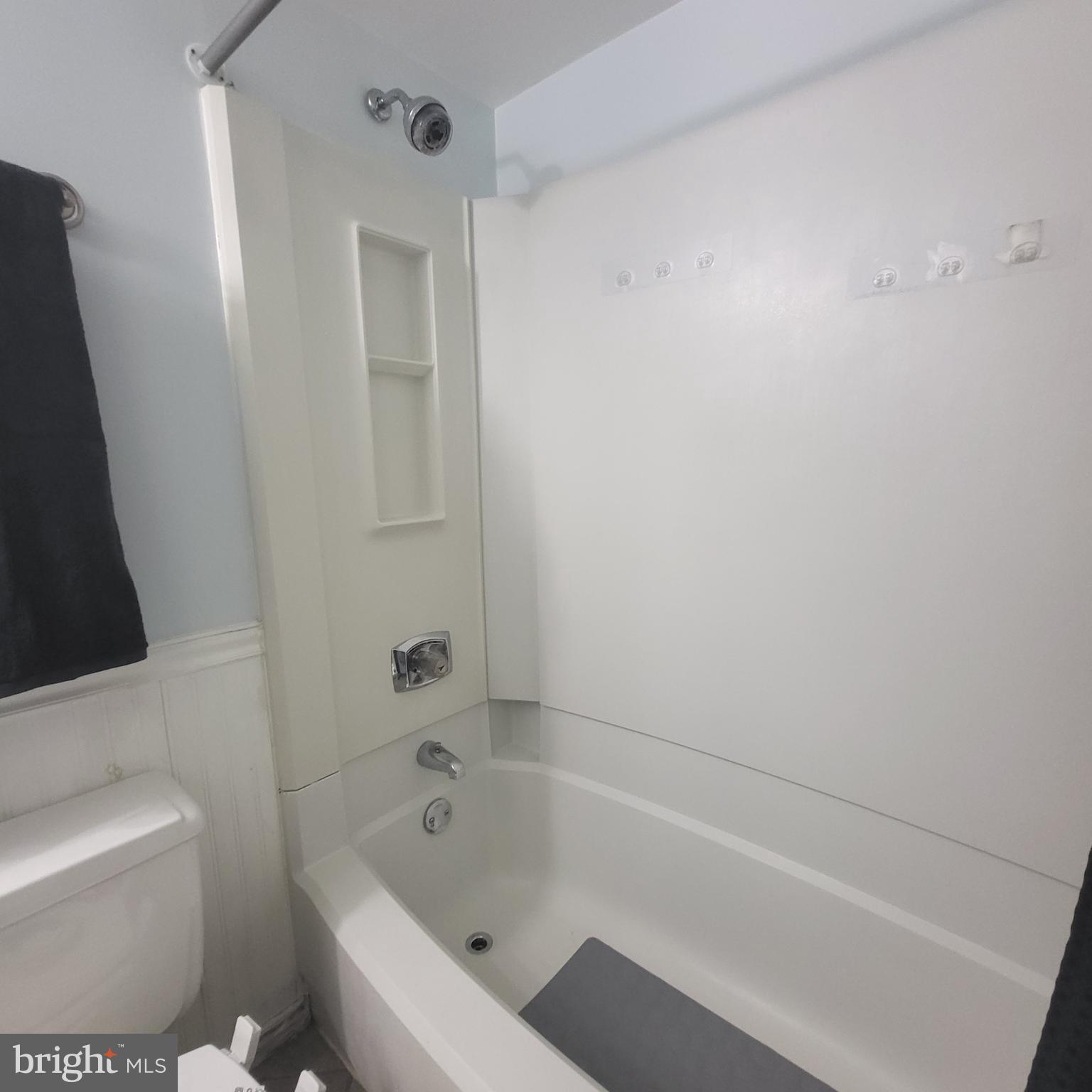 5800 Cove Landing Road, Unit 303 Burke, VA 22015 - Photo 65 of 84 a bathroom with a bathtub and toilet