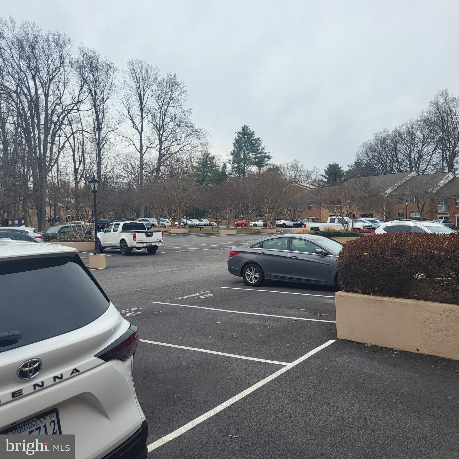 5800 Cove Landing Road, Unit 303 Burke, VA 22015 - Photo 68 of 84 a view of parking with cars parked