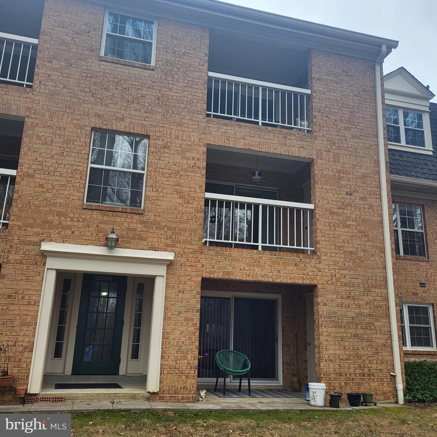 5800 Cove Landing Road, Unit 303 Burke, VA 22015 - Photo 70 of 84 a front view of a house with yard