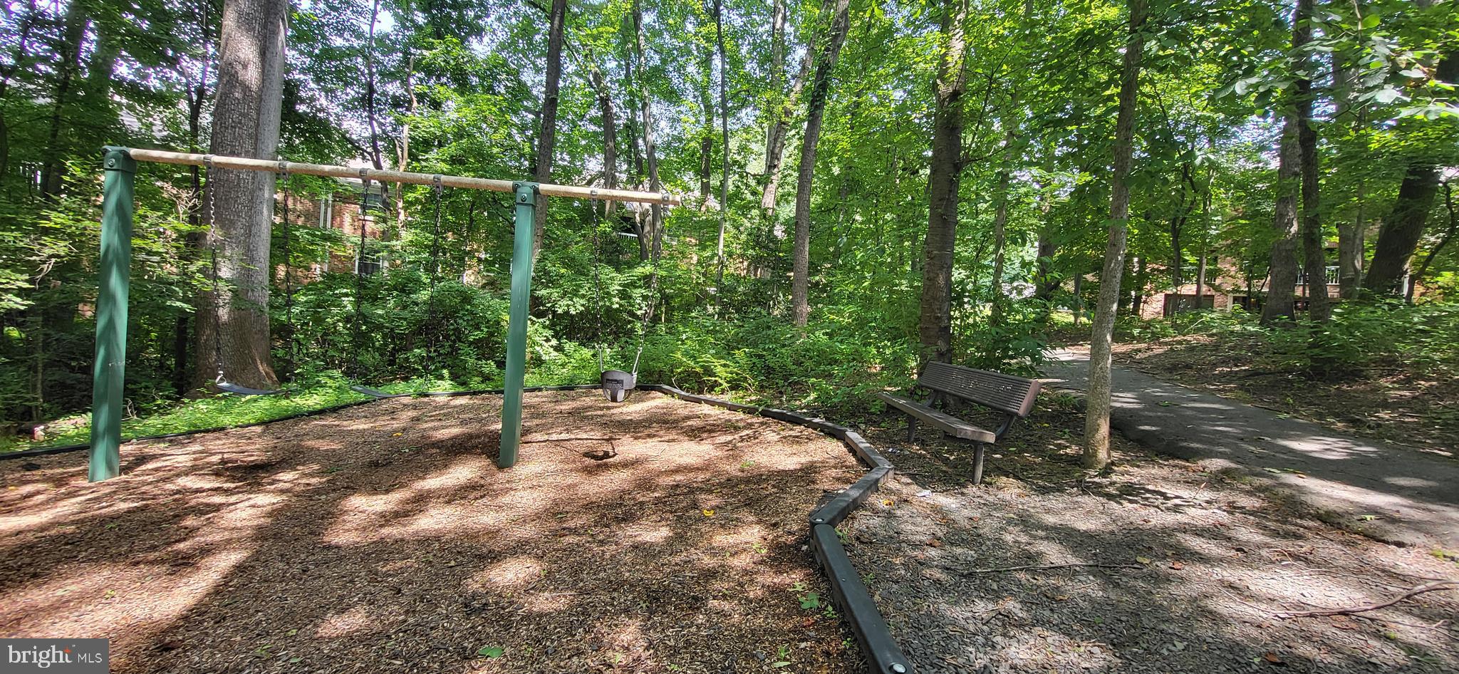 5800 Cove Landing Road, Unit 303 Burke, VA 22015 - Photo 72 of 84 a backyard of a house with lots of green space