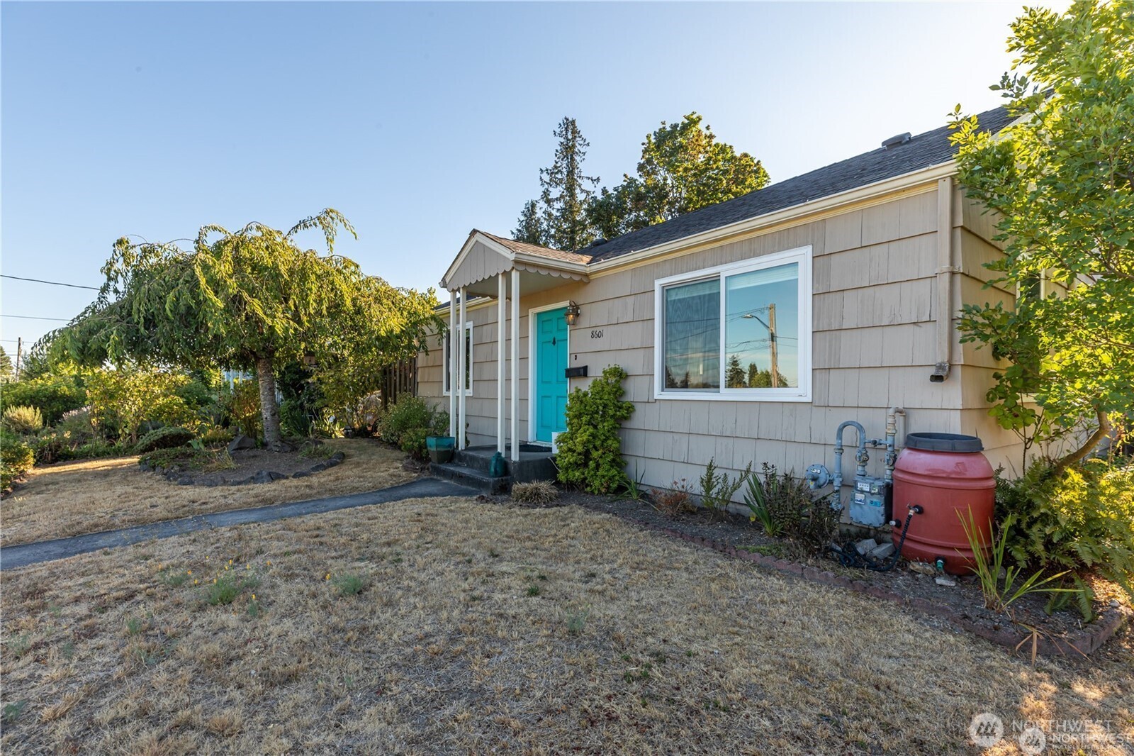 8601 36th Avenue Southwest Seattle, WA 98126 - Photo 2 of 28 a view of a house with a backyard and sitting area