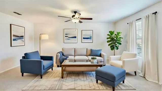 a living room with furniture potted plant and a window