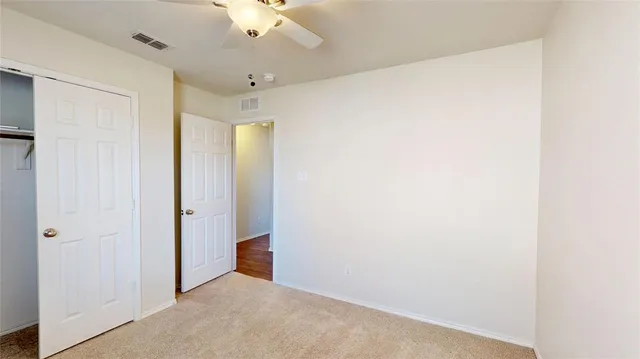 an empty room with a bathroom