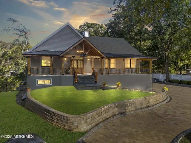 a view of a house with pool yard and a chairs