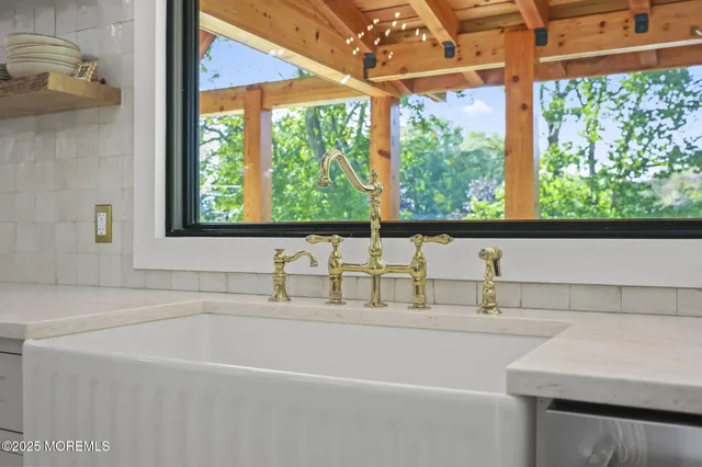 a view of a livingroom with furniture and staircase