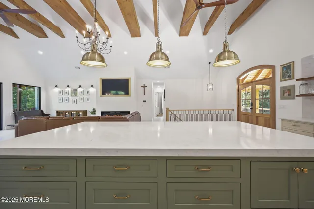 a view of a dining room with furniture and window