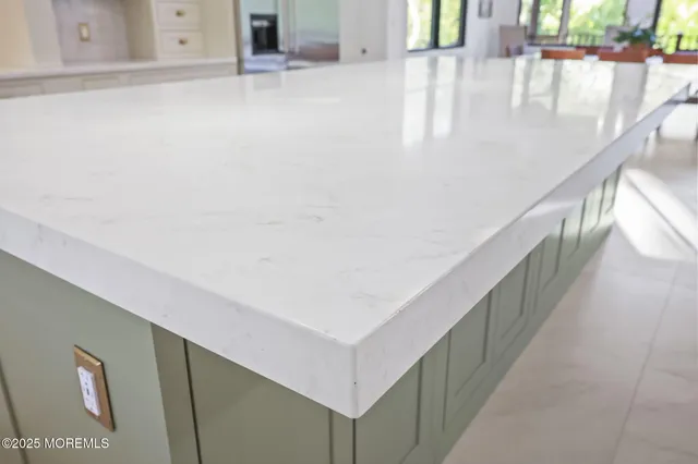 a kitchen with a table and chairs in it