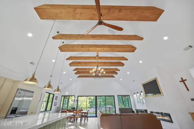 a bed room with a bed tv and a window