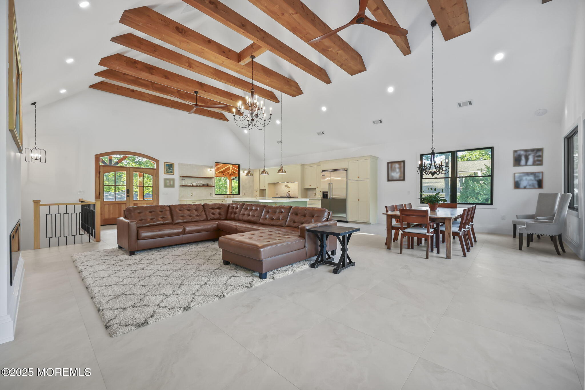 422 Green Grove Road Asbury Park, NJ 07712 - Photo 26 of 82 a living room with lots of furniture and a chandelier