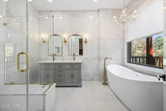 a kitchen with stainless steel appliances kitchen island granite countertop a table chairs sink and cabinets