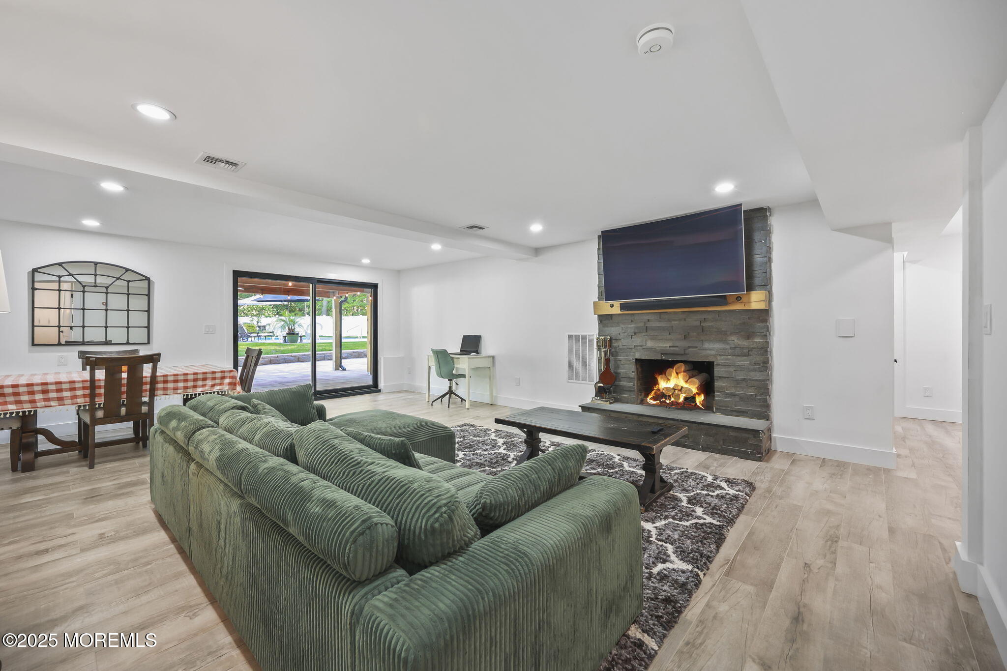 422 Green Grove Road Asbury Park, NJ 07712 - Photo 47 of 82 a living room with furniture and a fireplace
