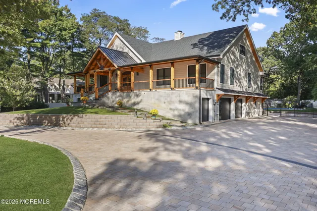 a kitchen with white cabinets and a window