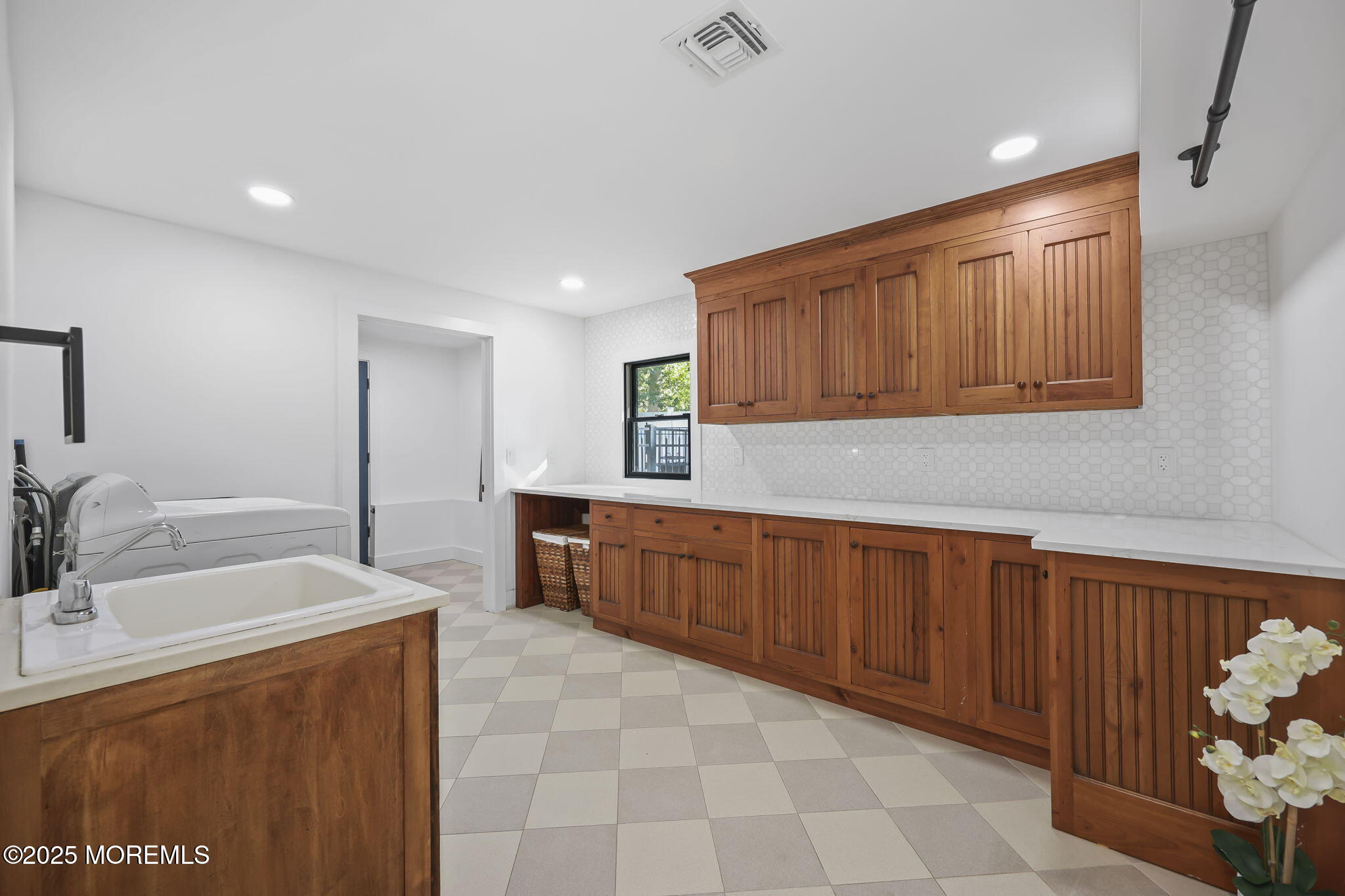 422 Green Grove Road Asbury Park, NJ 07712 - Photo 58 of 82 a large kitchen with stainless steel appliances wooden cabinets a stove and a sink