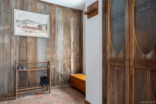 a kitchen with cabinets and wooden floor