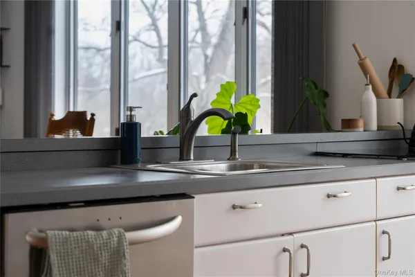 a kitchen with a stove and cabinets