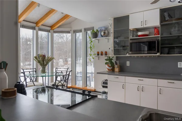 a view of a dining room with furniture window and outside view